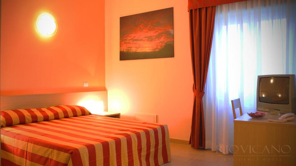 Postel nebo postele na pokoji v ubytování Rio Vicano Residence Hotel