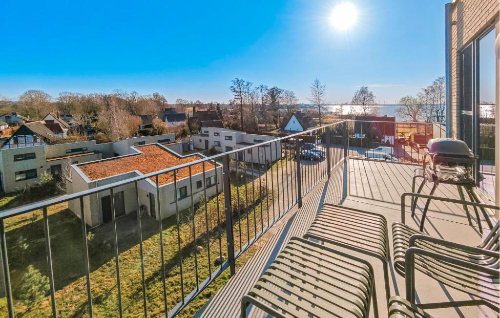 a balcony with a bench and a view of a city at Penthouse Deluxe in Lembruch