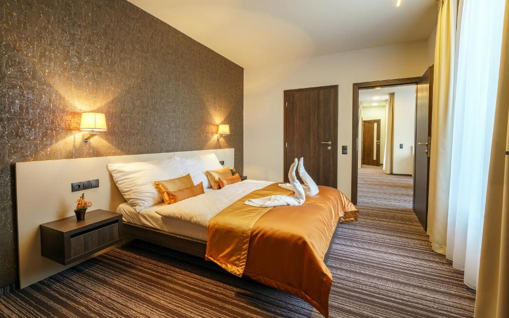 Postel nebo postele na pokoji v ubytování Horizont Resort