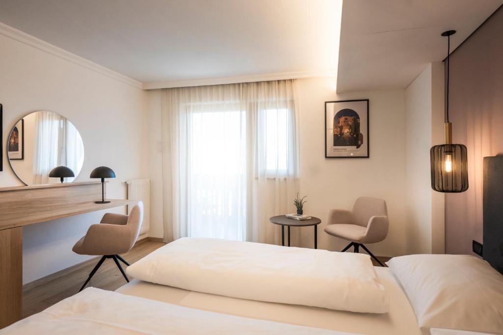 Postel nebo postele na pokoji v ubytování Hotel Erzherzog Johann