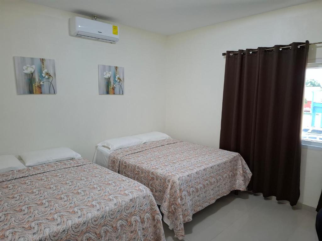 Ένα ή περισσότερα κρεβάτια σε δωμάτιο στο Maho's Apartamentos