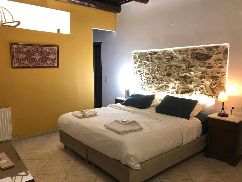 Ένα ή περισσότερα κρεβάτια σε δωμάτιο στο Ξενώνας Ηδύλη