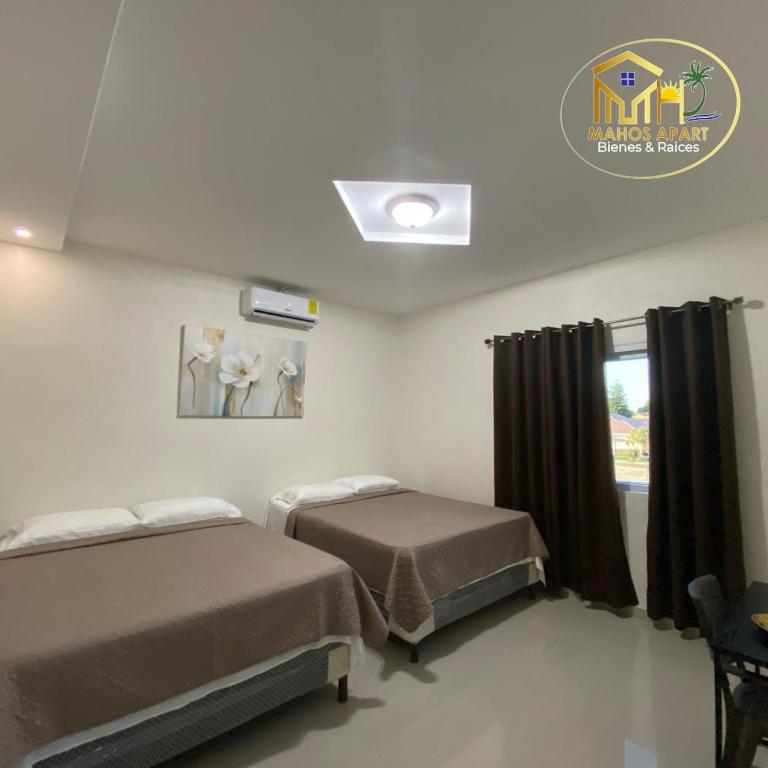Ένα ή περισσότερα κρεβάτια σε δωμάτιο στο Maho's Apartamentos