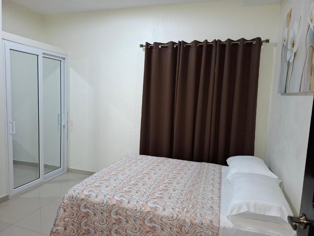 Ένα ή περισσότερα κρεβάτια σε δωμάτιο στο Maho's Apartamentos