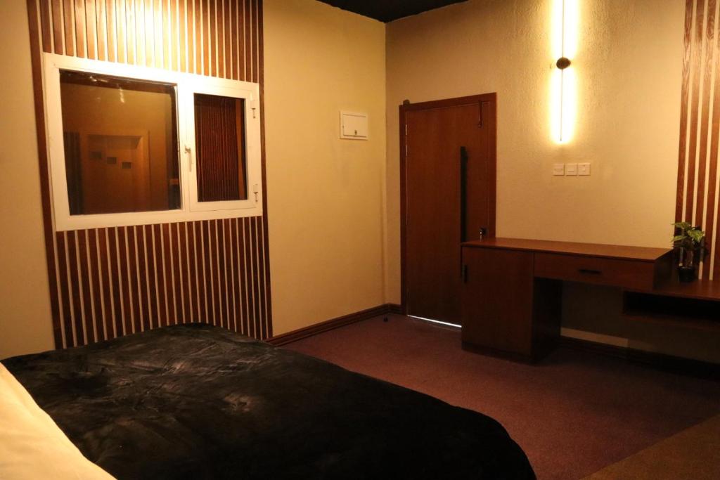 Postel nebo postele na pokoji v ubytování طلائع السوادي