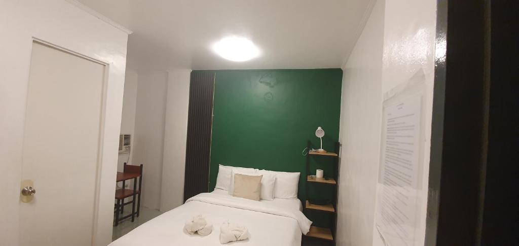 Postel nebo postele na pokoji v ubytování AJ Tourist Inn