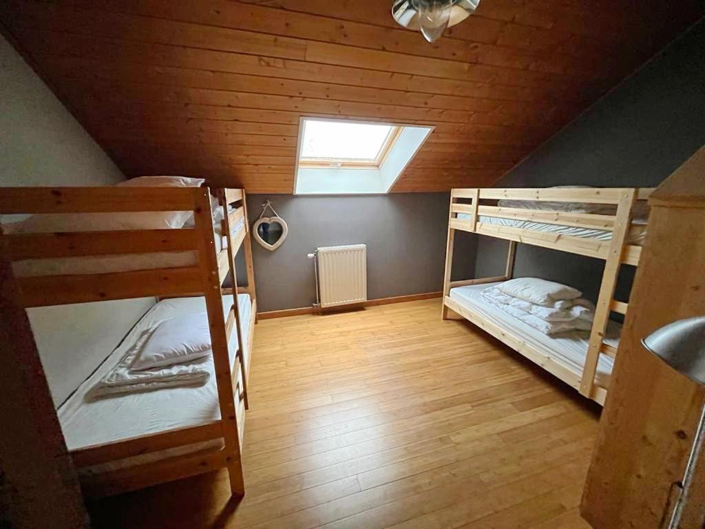 Postel nebo postele na pokoji v ubytování Le Bercail