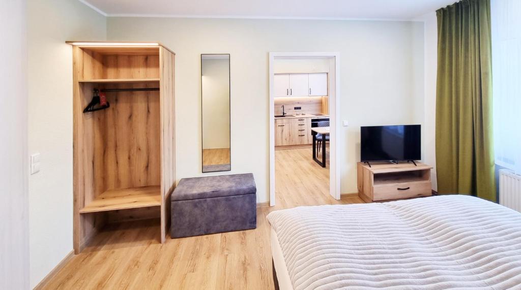 TV a/nebo společenská místnost v ubytování Hotel Erlebnis Wald