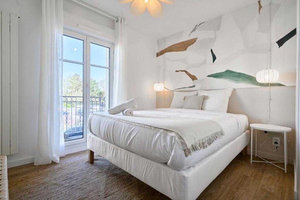 Postel nebo postele na pokoji v ubytování Appartement une chambre avec 3 balcons et parking