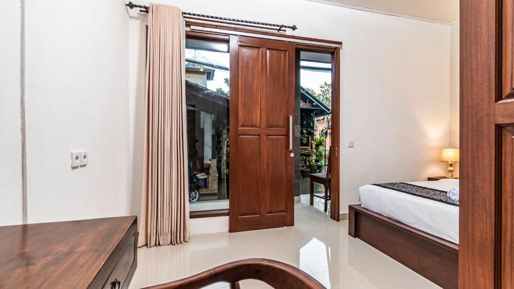 Postel nebo postele na pokoji v ubytování Teba Kauh Ubud