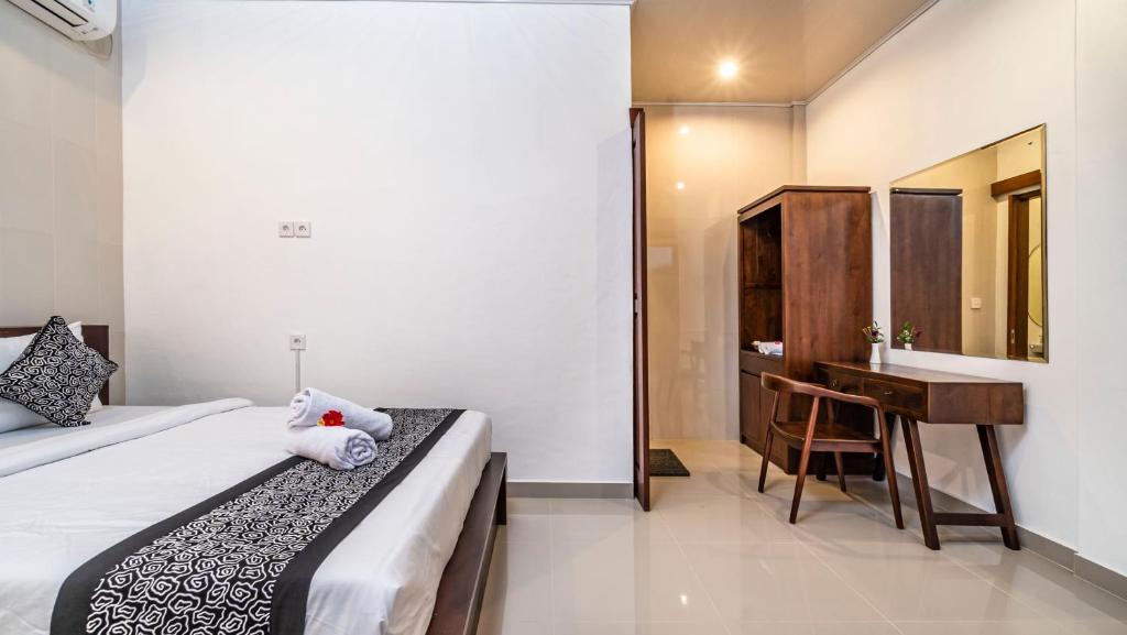 Postel nebo postele na pokoji v ubytování Teba Kauh Ubud