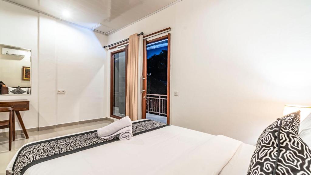 Postel nebo postele na pokoji v ubytování Teba Kauh Ubud