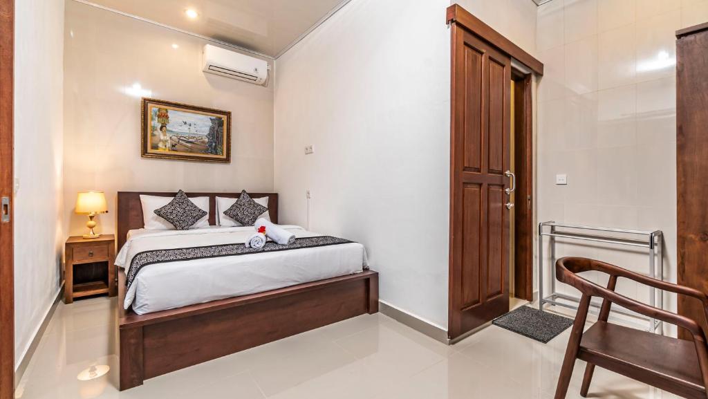 Postel nebo postele na pokoji v ubytování Teba Kauh Ubud