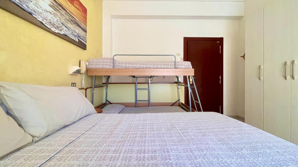 Postel nebo postele na pokoji v ubytování Hotel Zanella