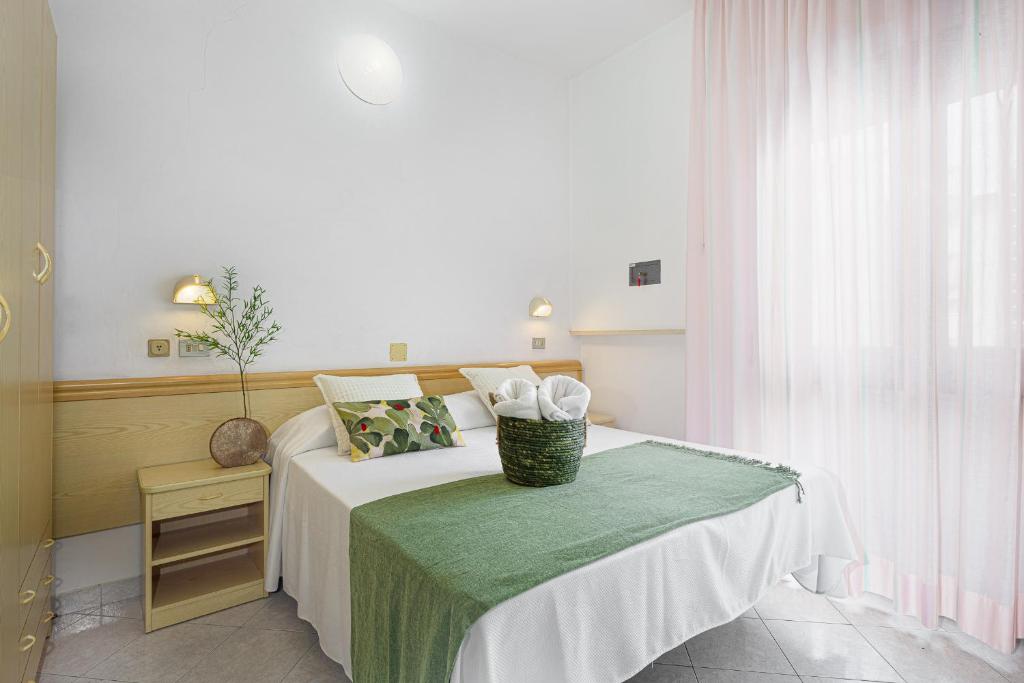 Postel nebo postele na pokoji v ubytování Hotel Cola Frontemare