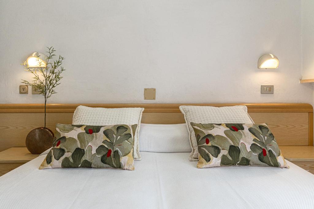 Postel nebo postele na pokoji v ubytování Hotel Cola Frontemare