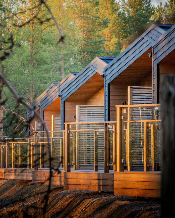 a rendering of a log home with windows at Wilderness Hotel Nellim & Igloos in Inari