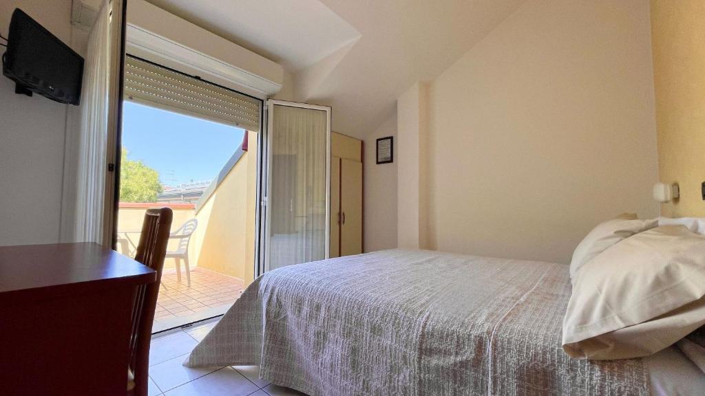 Postel nebo postele na pokoji v ubytování Hotel Zanella