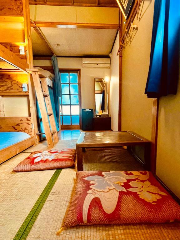 Postel nebo postele na pokoji v ubytování Guesthouse Azumaya