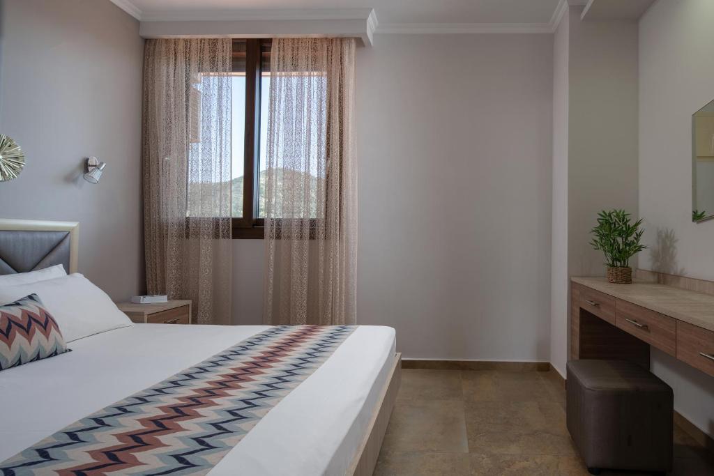 Postel nebo postele na pokoji v ubytování Anthemida Rooms