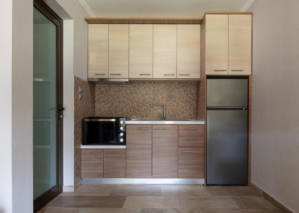 Kuchyň nebo kuchyňský kout v ubytování Anthemida Rooms