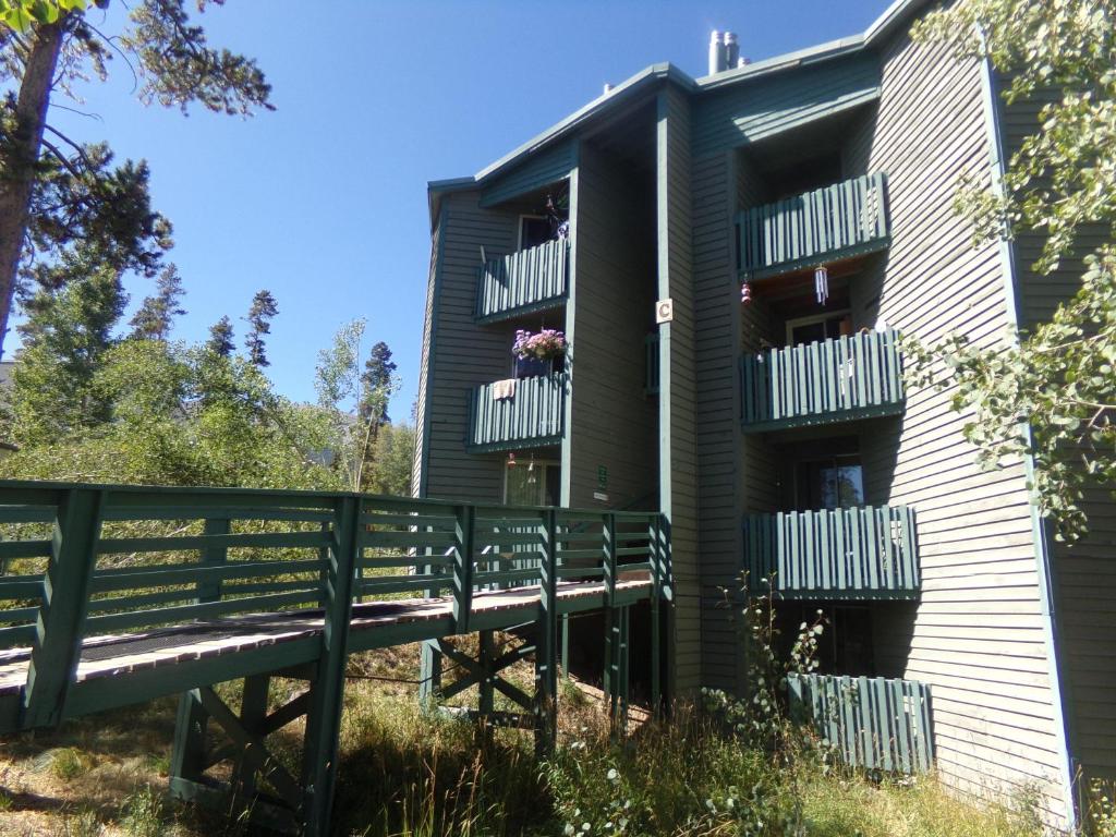 a building with balconies and a bench in front of it at Treehouse 2 bed 2 bath C THWC in Silverthorne