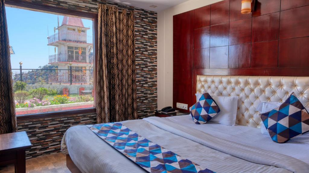 Voodi või voodid majutusasutuse Basera Hotel toas
