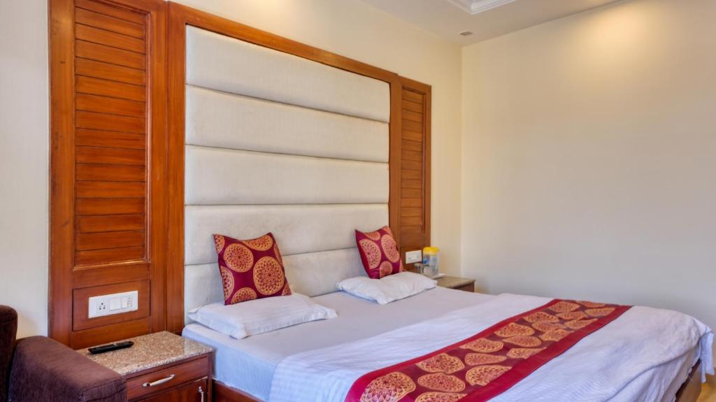 Voodi või voodid majutusasutuse Basera Hotel toas
