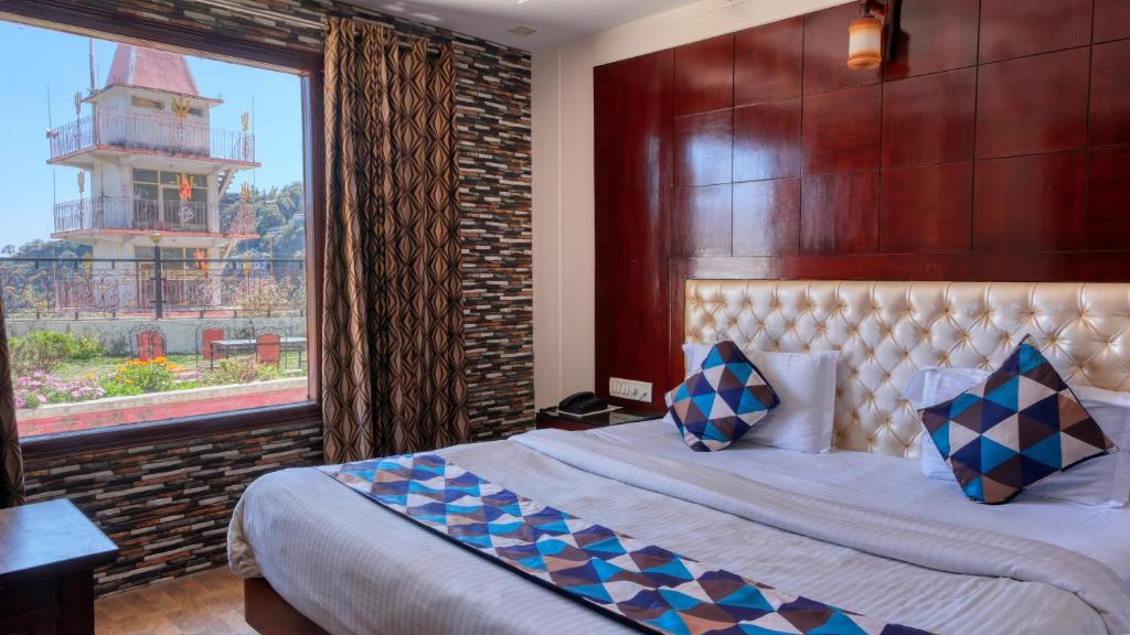 Voodi või voodid majutusasutuse Basera Hotel toas