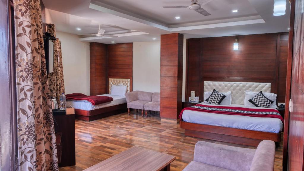 Voodi või voodid majutusasutuse Basera Hotel toas