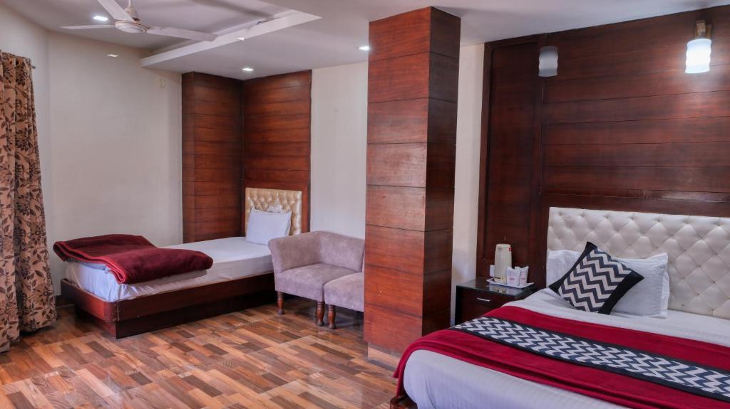 Voodi või voodid majutusasutuse Basera Hotel toas