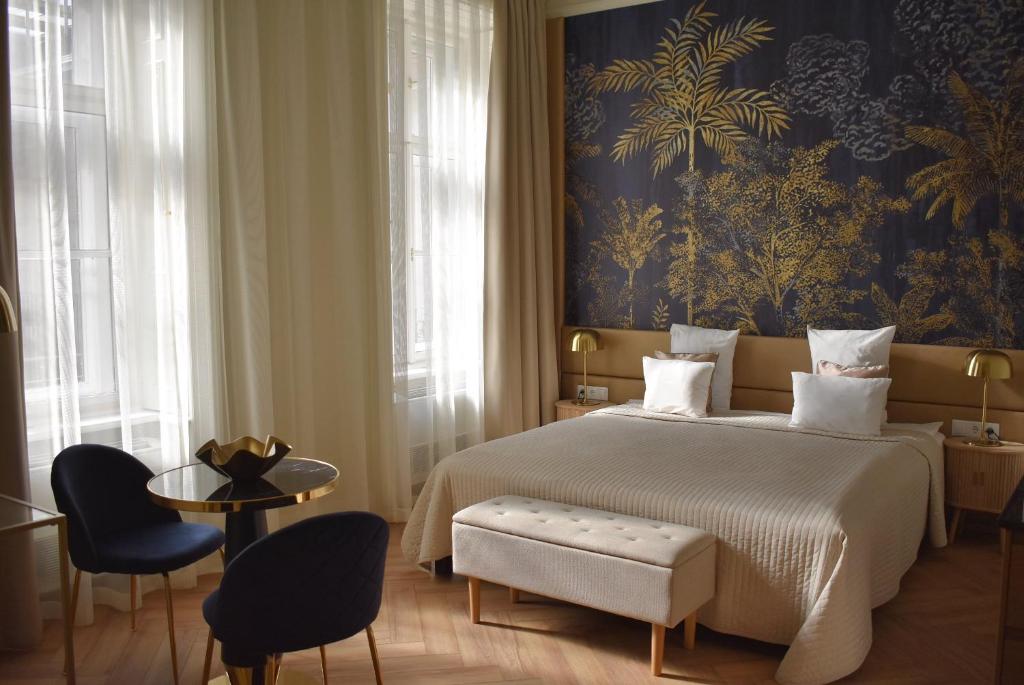 Posteľ alebo postele v izbe v ubytovaní Harmonia Palace