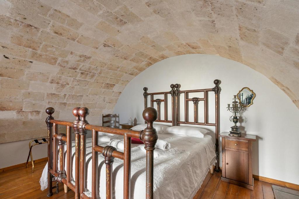 Łóżko lub łóżka w pokoju w obiekcie Masseria Antoglia Rooms