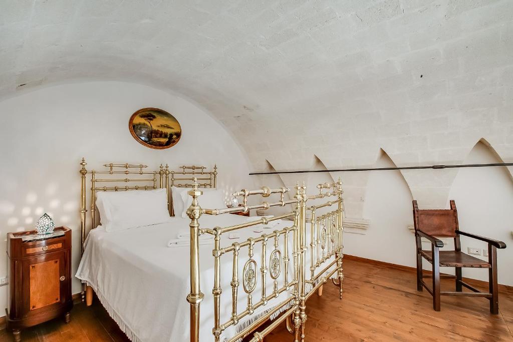 Łóżko lub łóżka w pokoju w obiekcie Masseria Antoglia Rooms