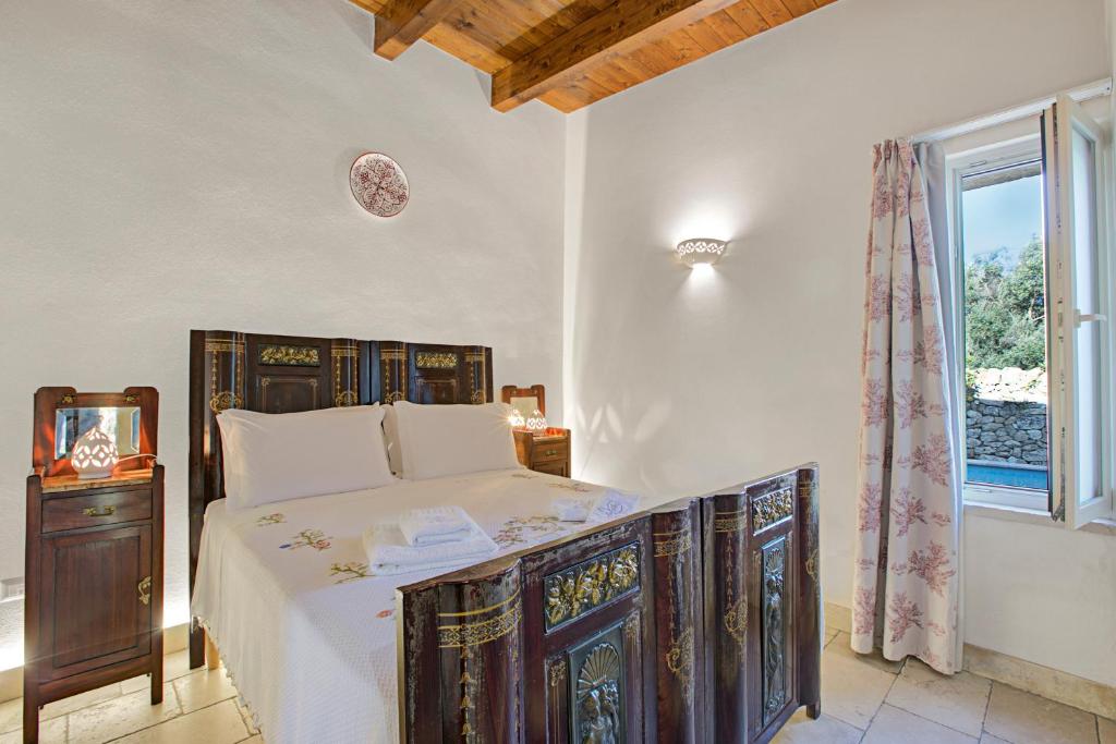 Łóżko lub łóżka w pokoju w obiekcie Masseria Antoglia Rooms