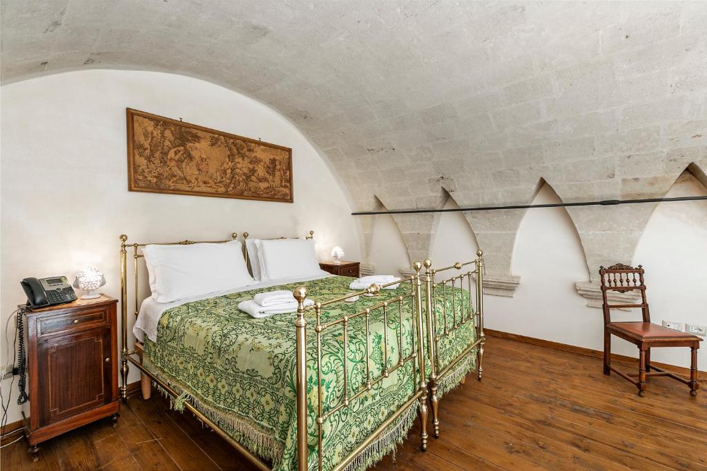 Łóżko lub łóżka w pokoju w obiekcie Masseria Antoglia Rooms