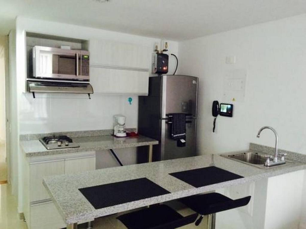 Una cocina o zona de cocina en Rent Apartments Manizales