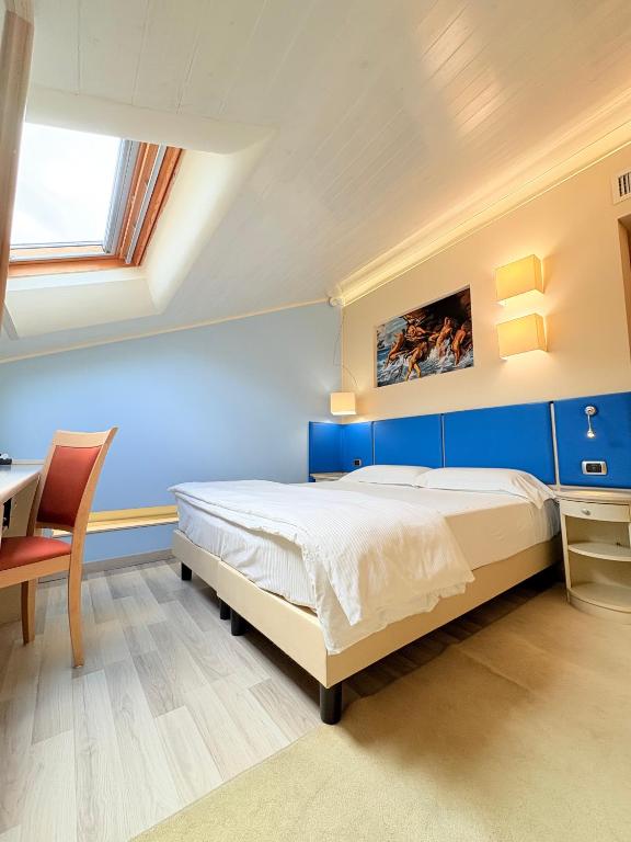 Postel nebo postele na pokoji v ubytování Portercole B&B