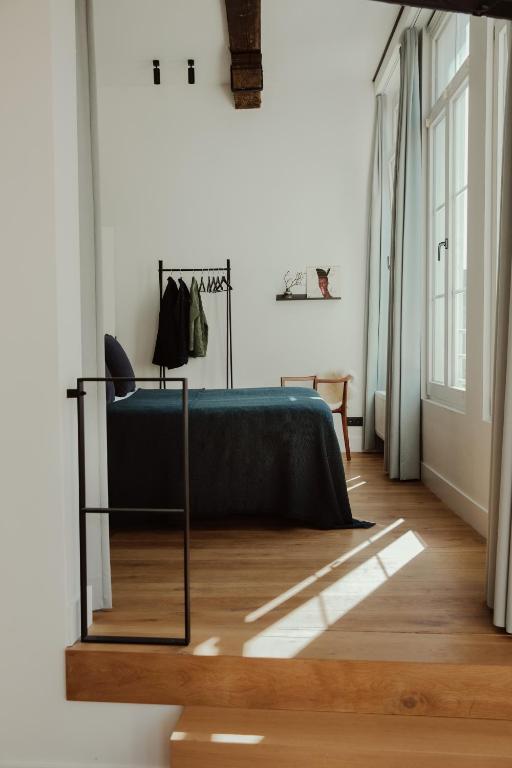 Postel nebo postele na pokoji v ubytování Aplace Antwerp - marvellous hotel rooms - Oude koornmarkt 1