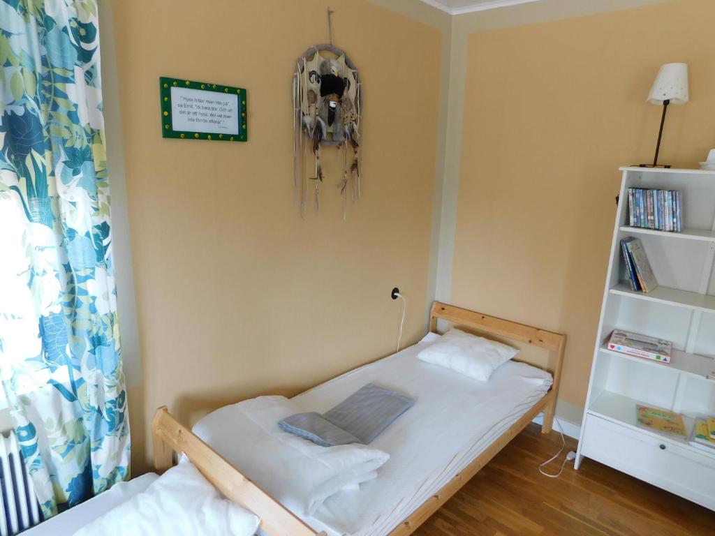 Postel nebo postele na pokoji v ubytování Vandrarhem Solgården