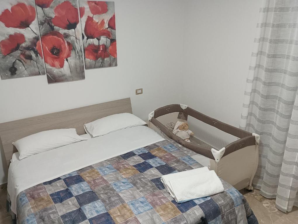 Postel nebo postele na pokoji v ubytování A casa di Elena e Francesco