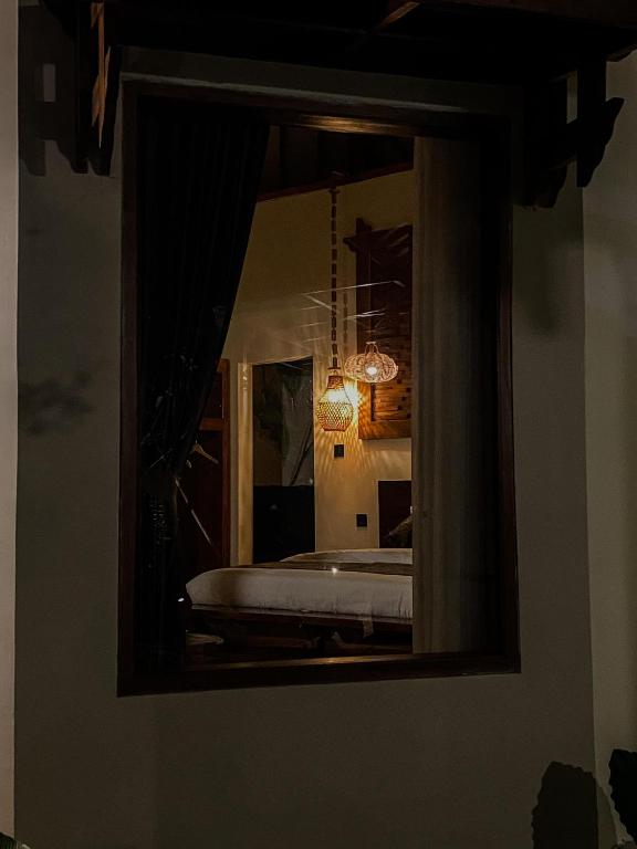 Postel nebo postele na pokoji v ubytování Arnez Tropical Cottage
