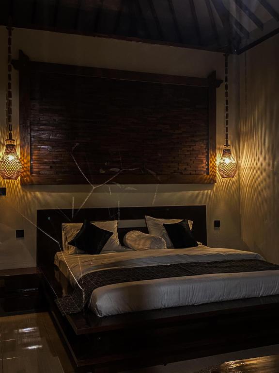 Postel nebo postele na pokoji v ubytování Arnez Tropical Cottage