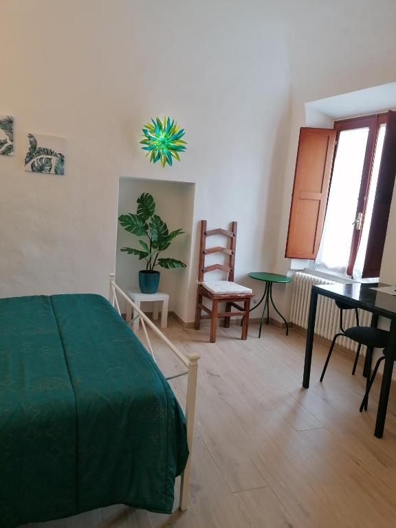 Postel nebo postele na pokoji v ubytování Camera Botanica