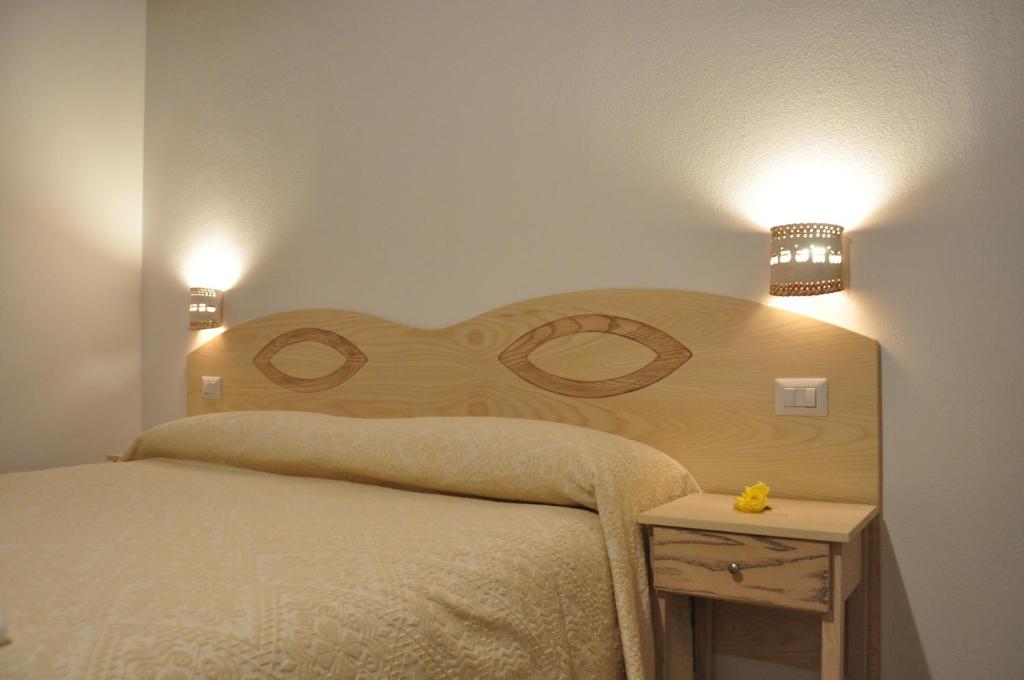 Postel nebo postele na pokoji v ubytování Agriturismo Sa Scalitta