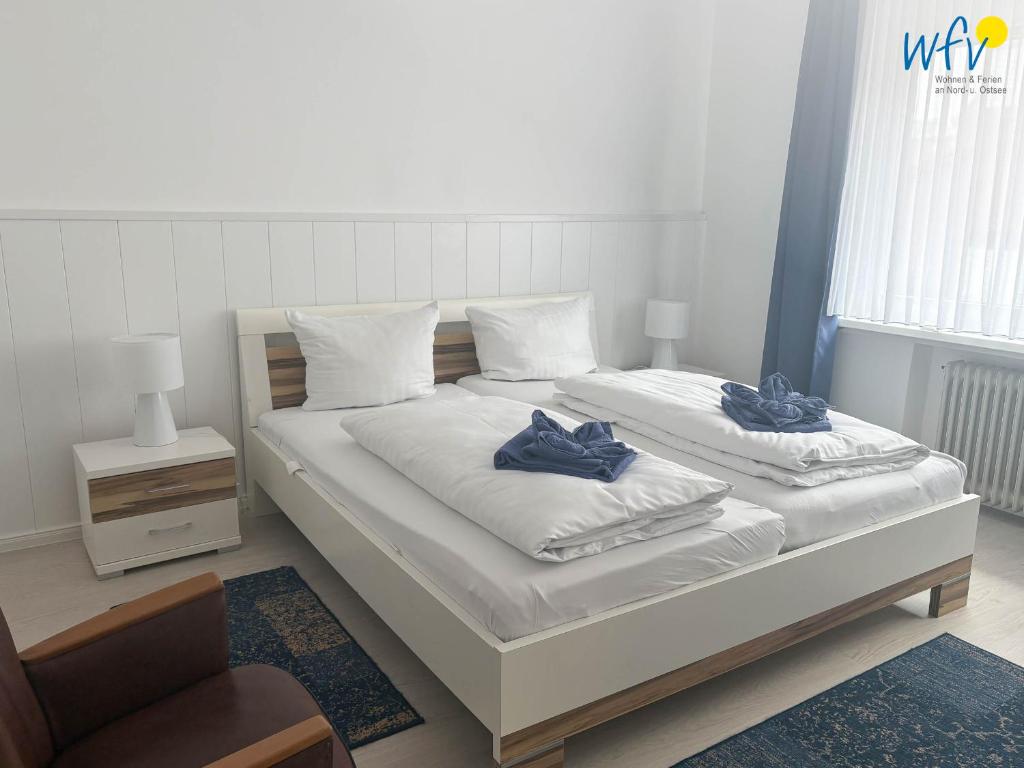 Postel nebo postele na pokoji v ubytování Villa Düna Ferienwohnung 5