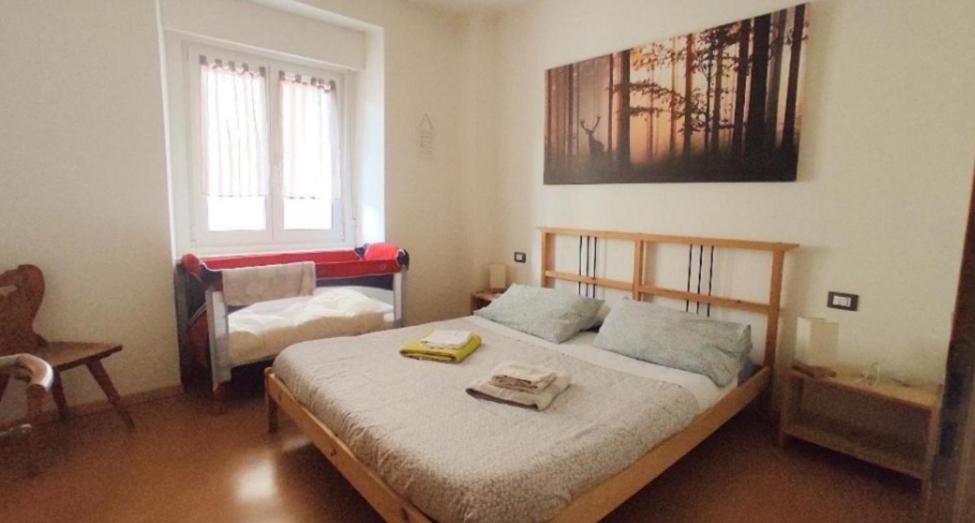 Posteľ alebo postele v izbe v ubytovaní Appartamenti Viola
