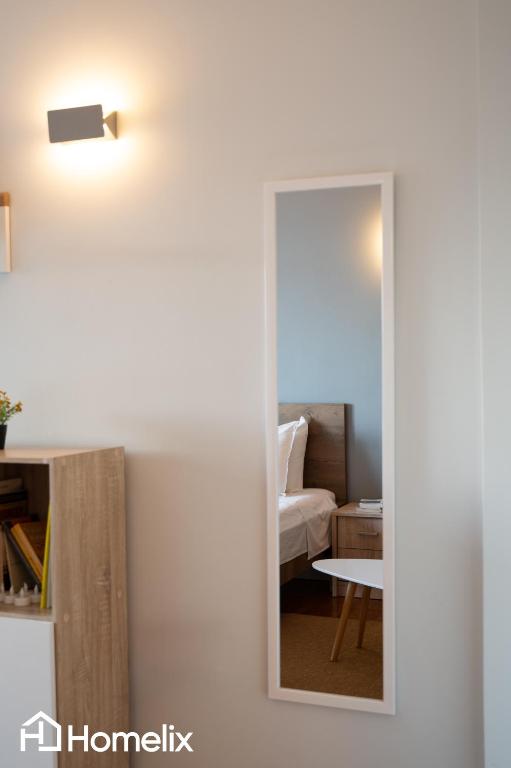 Posezení v ubytování 30m² Cosy studio with panoramic sea view