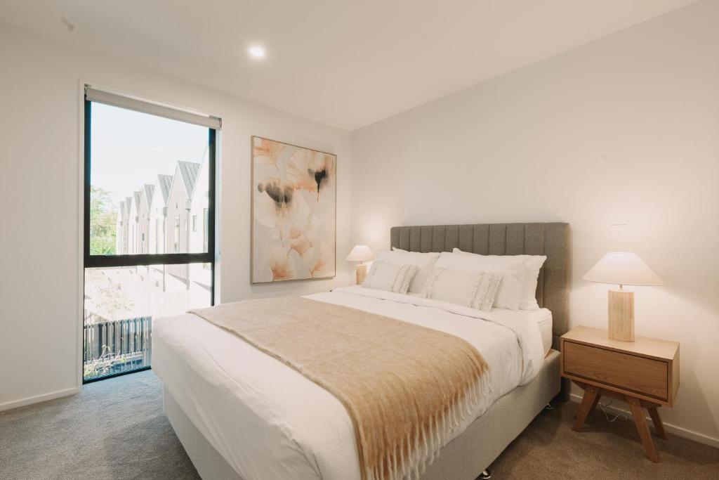 Katil atau katil-katil dalam bilik di Luxury CBD Apartment Free Parking