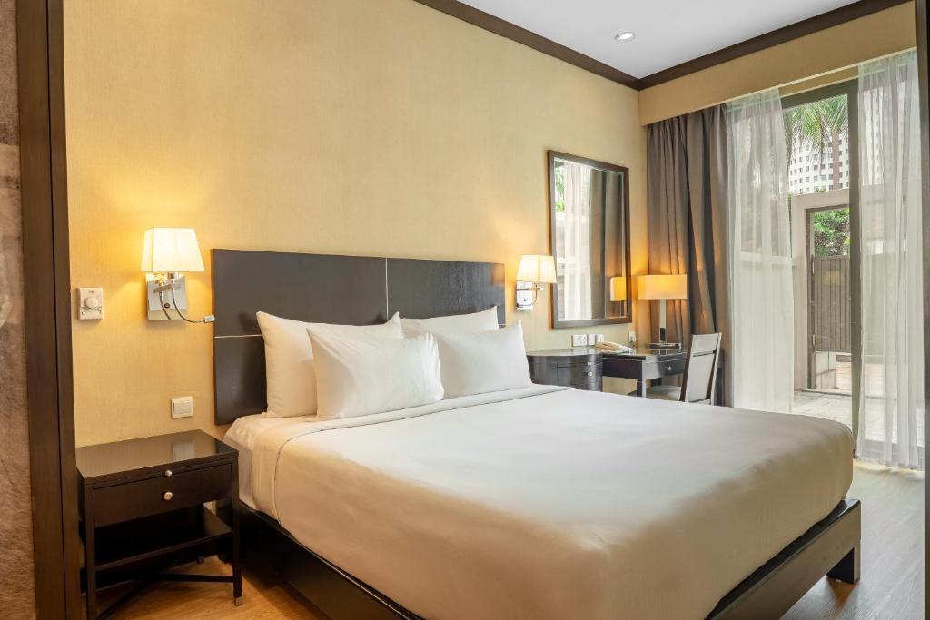 Postel nebo postele na pokoji v ubytování Micasa All Suites Hotel